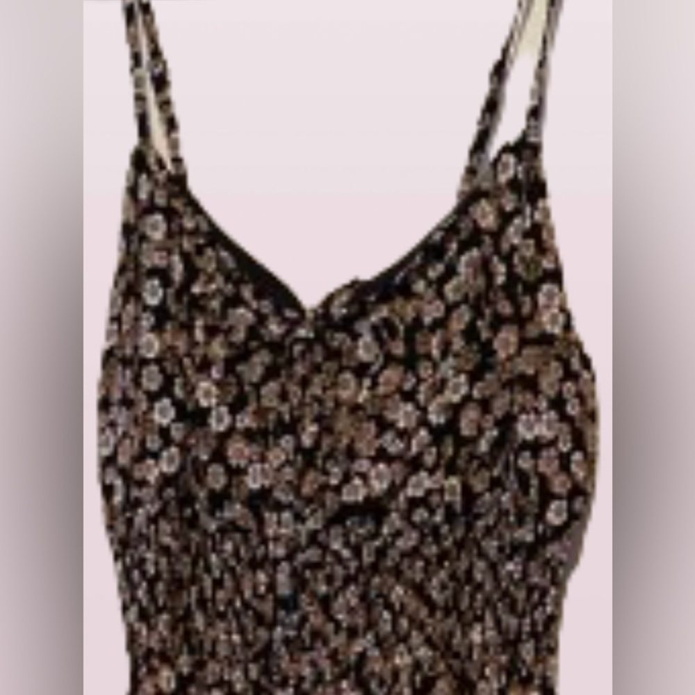 Sleeveless long floral dress, baggy top, stretch mid section and flow bottom